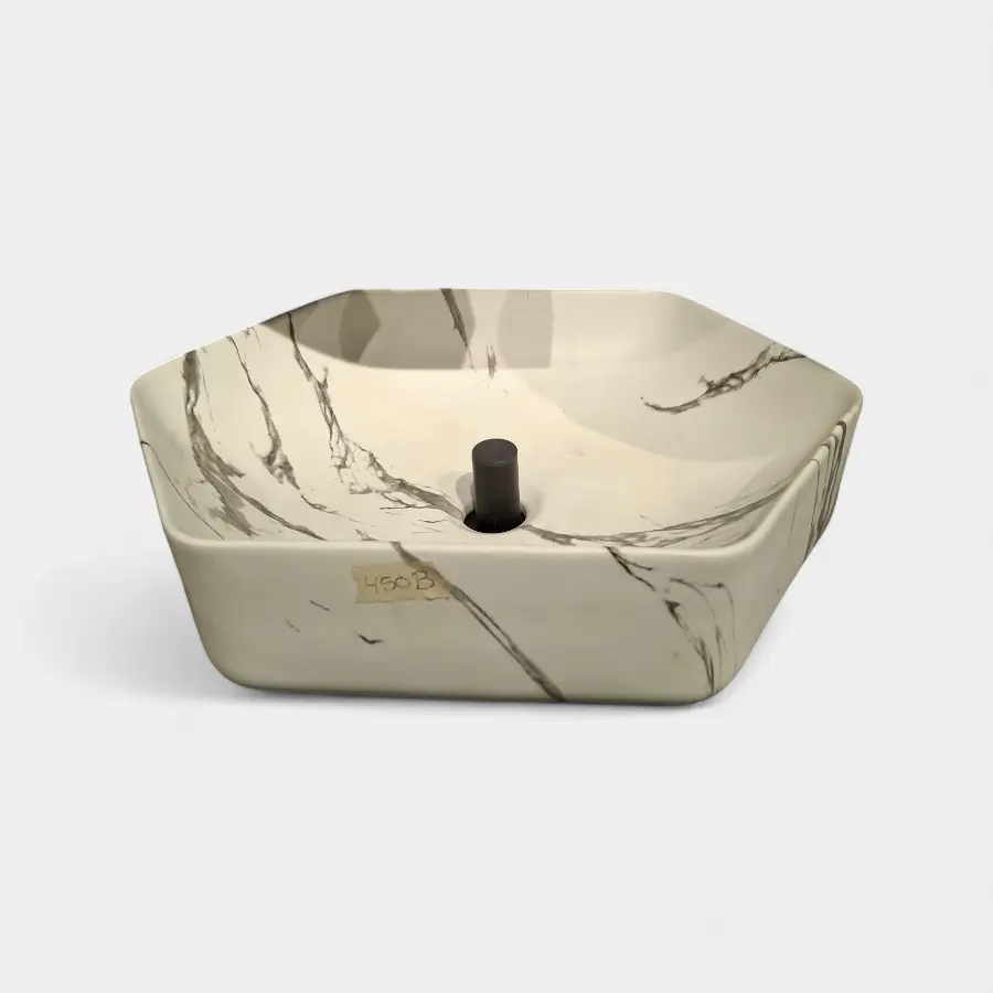 Lavamanos de sobreponer tipo Vessel exagonal en blanco mármol, acabado sofisticado de Innova Hogar, perfecto para baños modernos y de lujo.