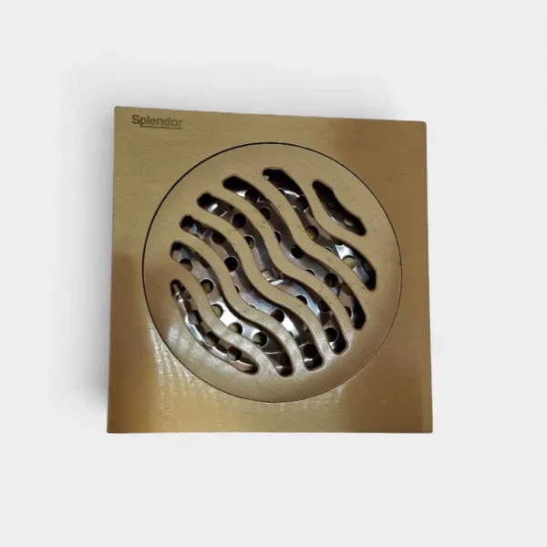 Rejilla anti olor de 10x10 cm dorada con diseño ondulado – Estética moderna y sellado hermético en INNOVA HOGAR