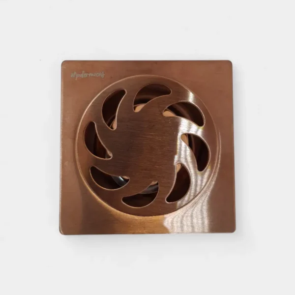 Rejilla anti olor de 10x10 cm en cobre con diseño radial – Estilo único y eficiencia en drenaje en INNOVA HOGAR
