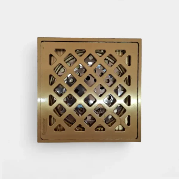 Rejilla anti olor de 10x10 cm dorada con diseño geométrico de rombos – Elegancia decorativa y sellado anti olores en INNOVA HOGAR